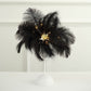 Black ostrich feather table lamp centerpiece with lights.