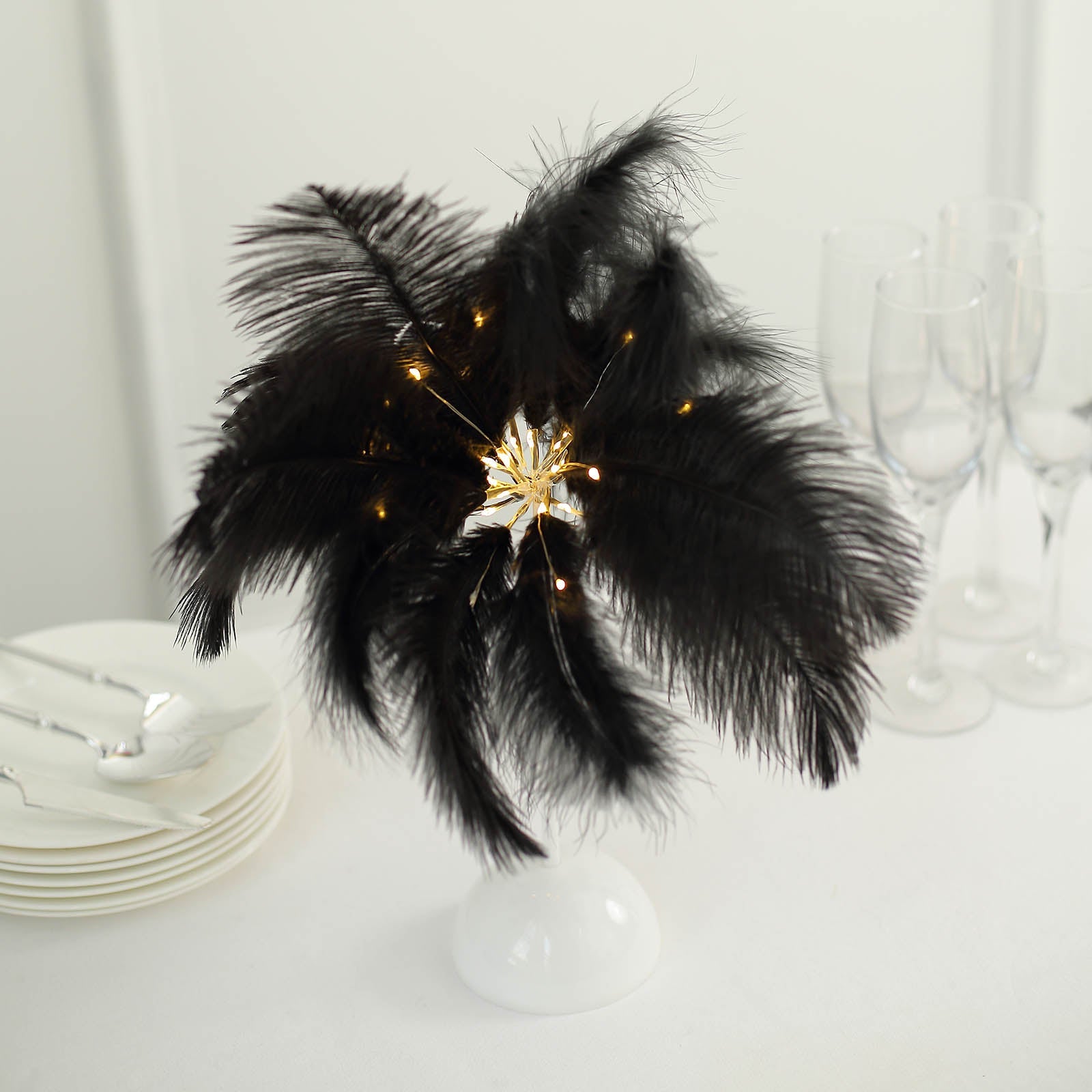Black ostrich feather table lamp centerpiece with LED lights.
