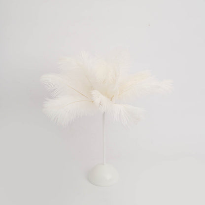 White ostrich feather table lamp centerpiece for weddings.