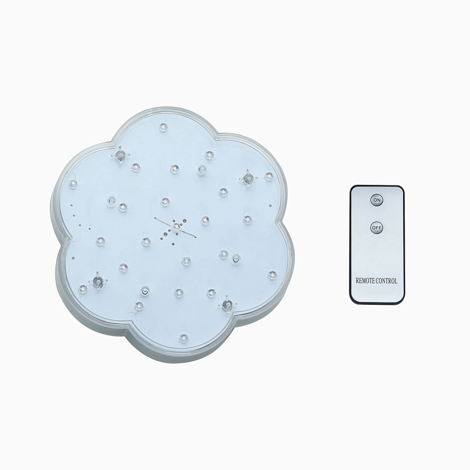 White flower-shaped LED disc light with remote control.