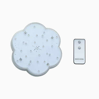 White flower-shaped LED disc light with remote control.