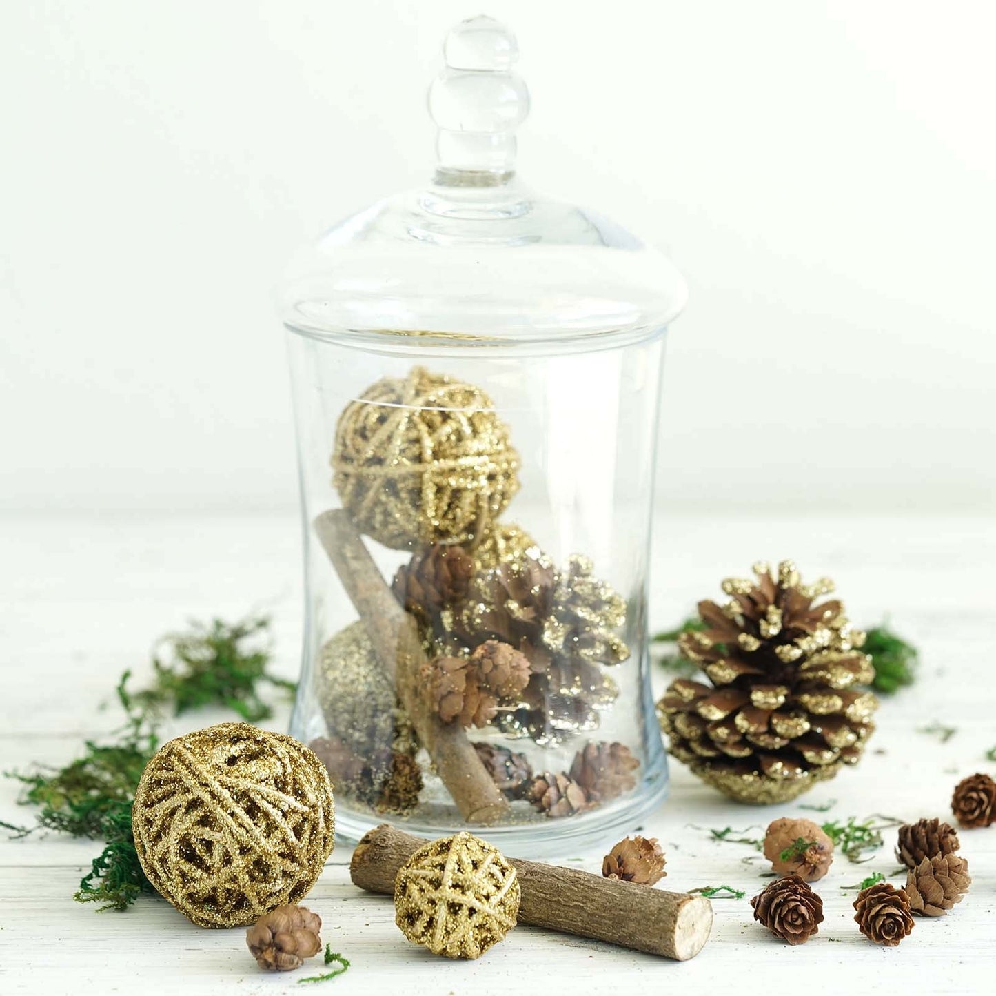 Natural dried assorted summer potpourri bowl fillers in gold and brown.