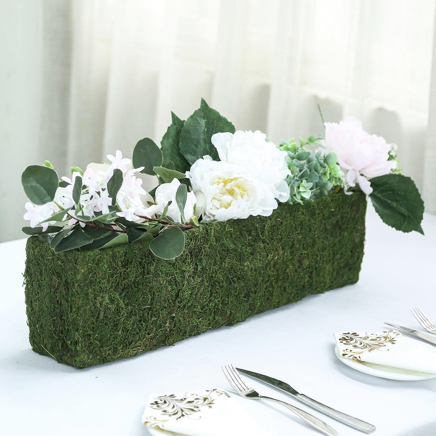 Green rectangle preserved moss metal planter box with flowers.