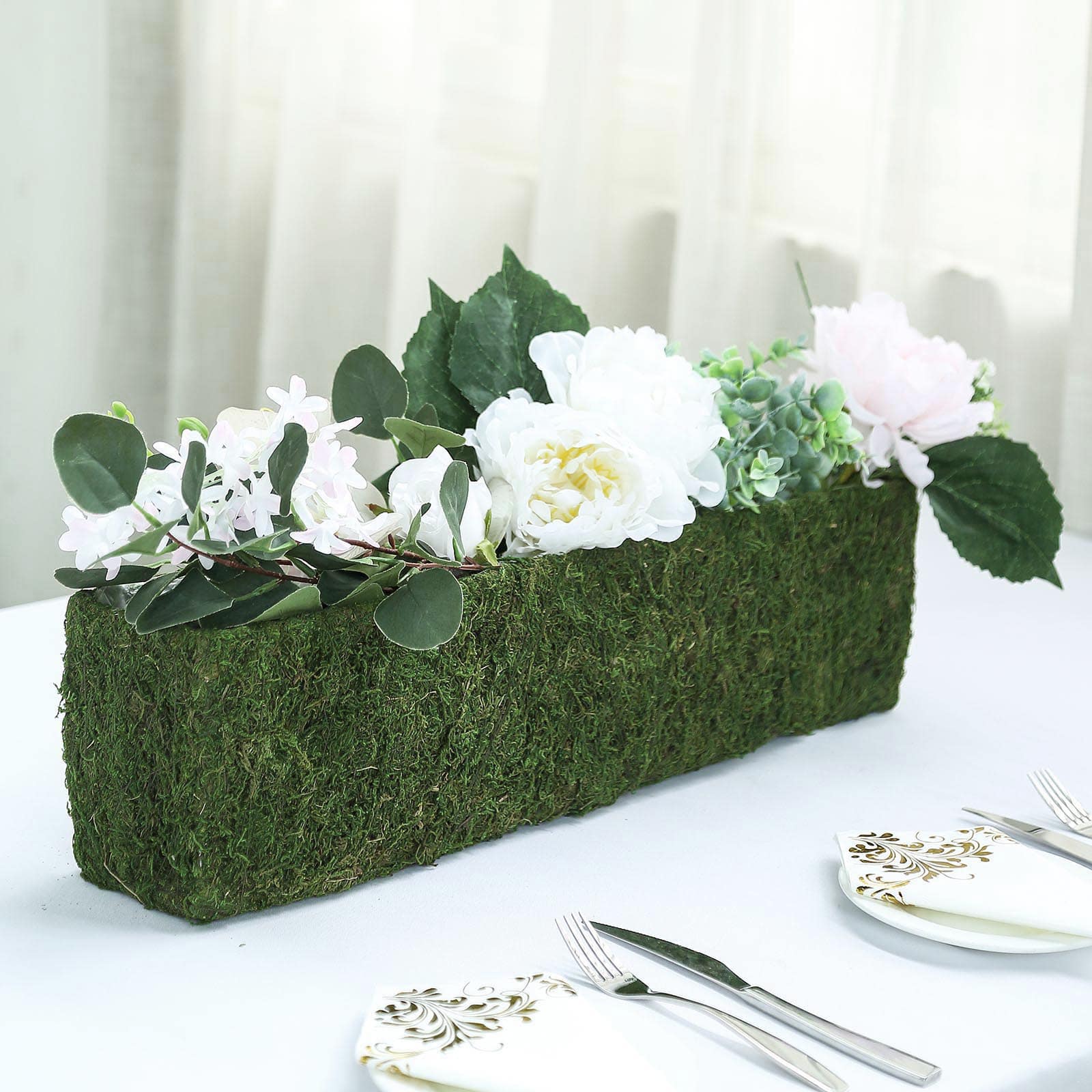 Green rectangle preserved moss metal planter box with flowers.