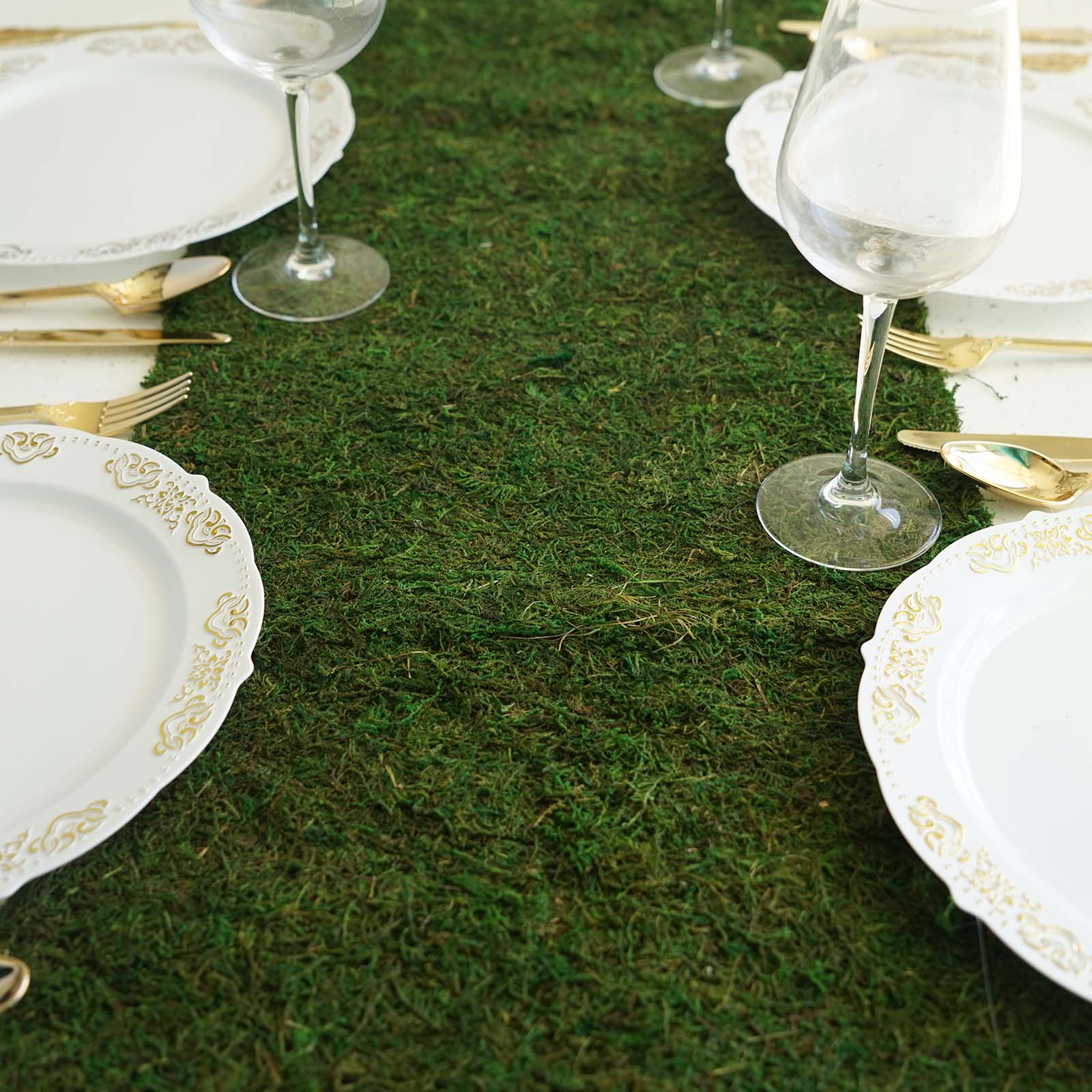 14"x48" green natural preserved moss table runner with fishnet grid on a dining table.
