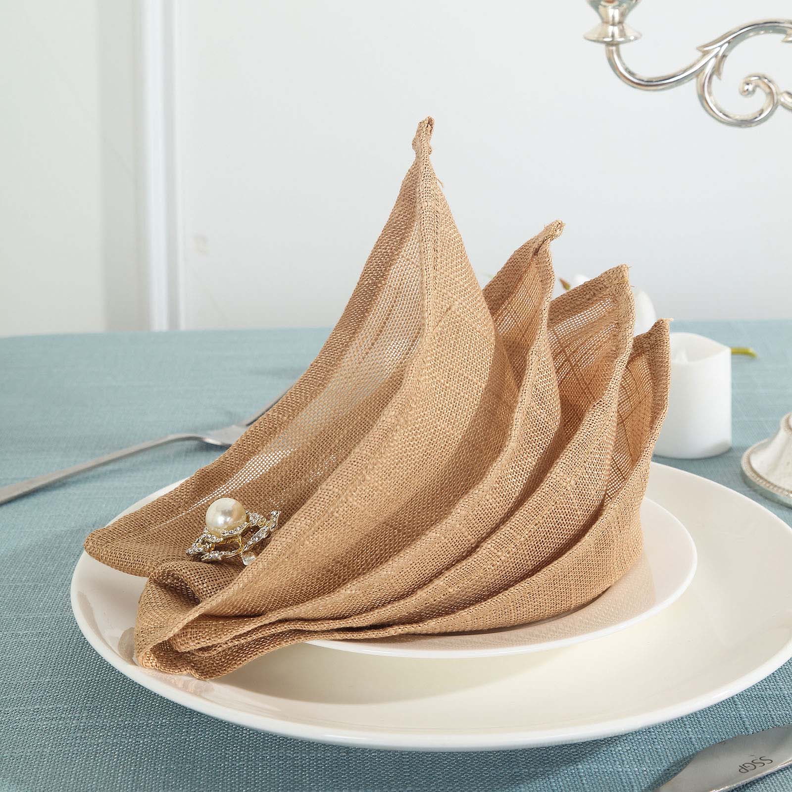 Natural slubby textured cloth dinner napkins in beige, wrinkle resistant linen.