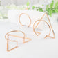 Gold geometric metal napkin rings in modern Nordic style.