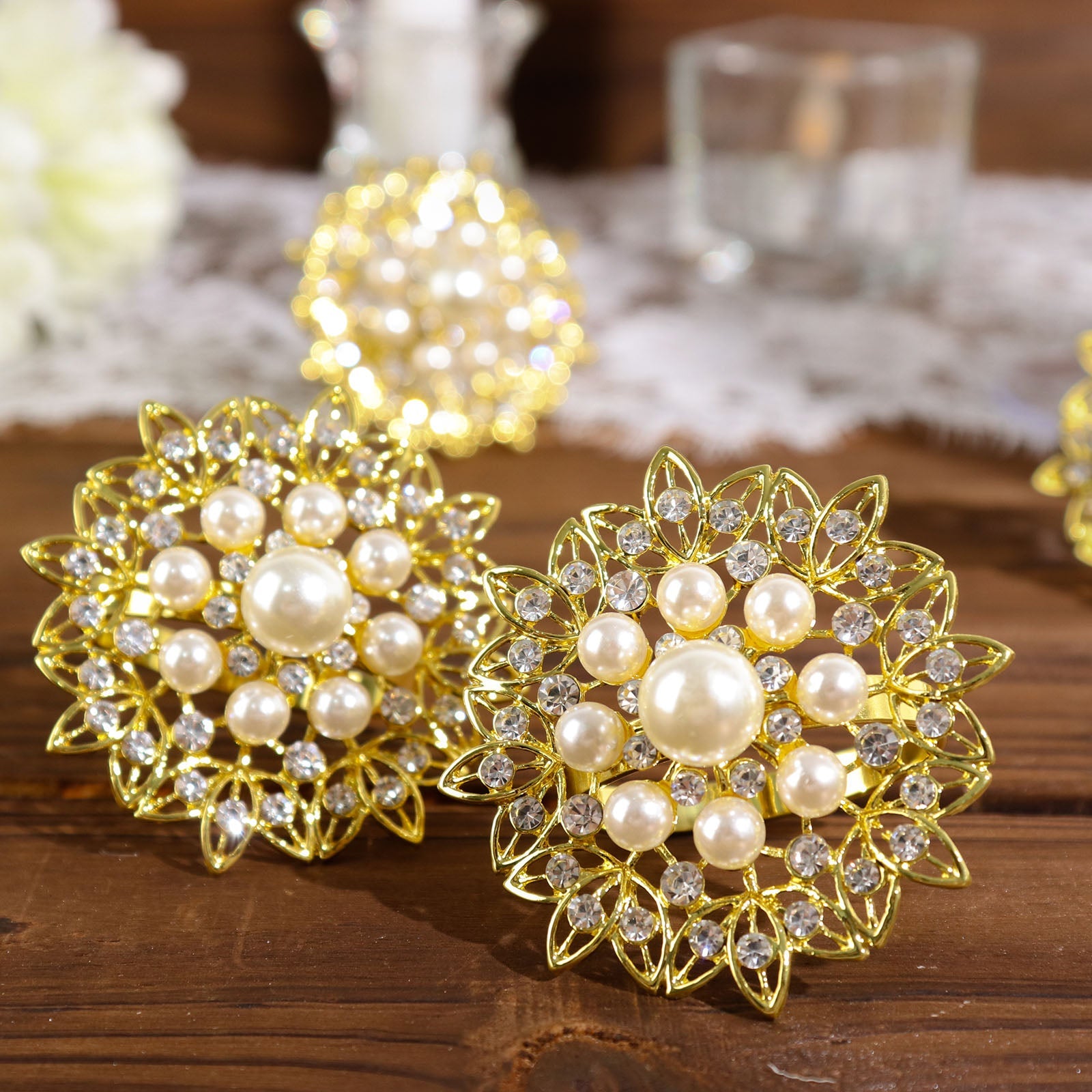 Gold pearl and diamond rhinestone flower napkin rings.