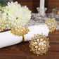 Gold pearl and diamond rhinestone flower napkin rings.