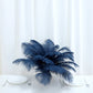 Navy blue natural plume ostrich feathers in a decorative centerpiece.