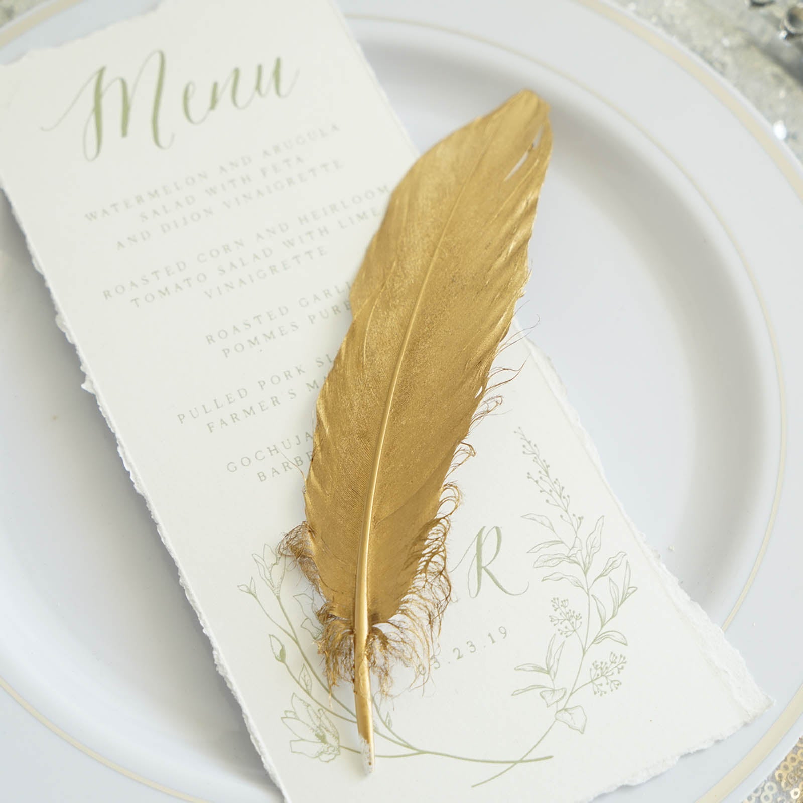 Metallic gold natural goose feather for elegant party decoration.