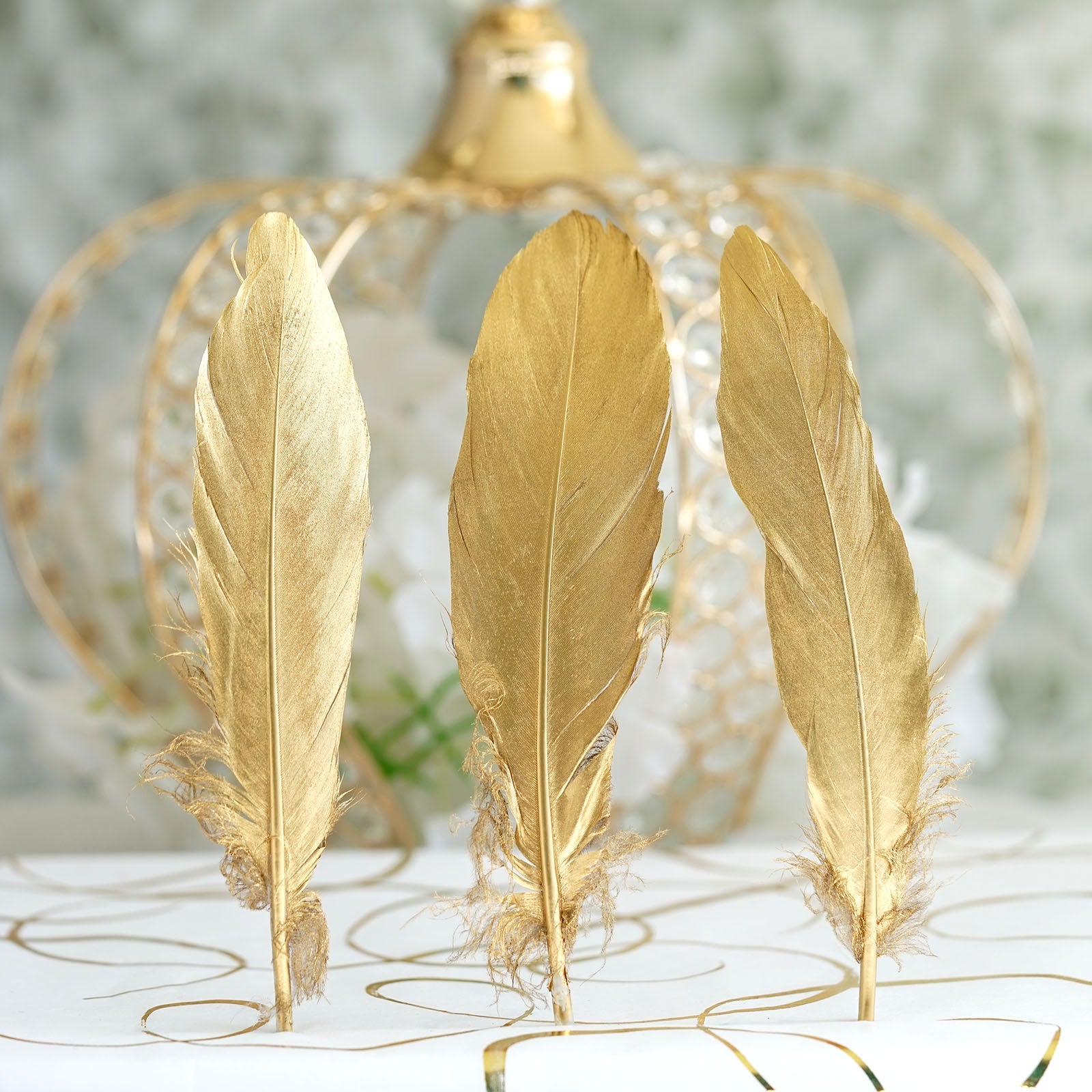Metallic gold natural goose feathers for party decoration.