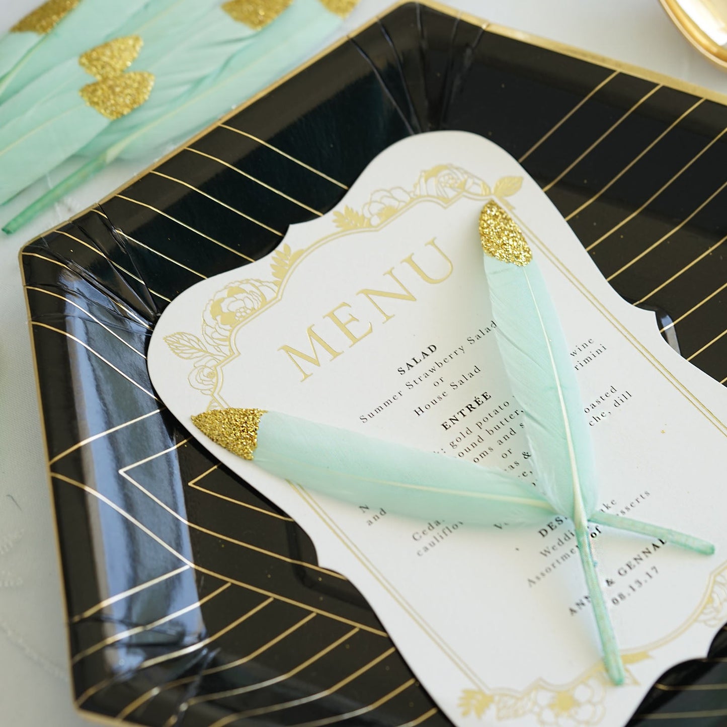 Glitter gold tip mint turkey feathers for party decoration.