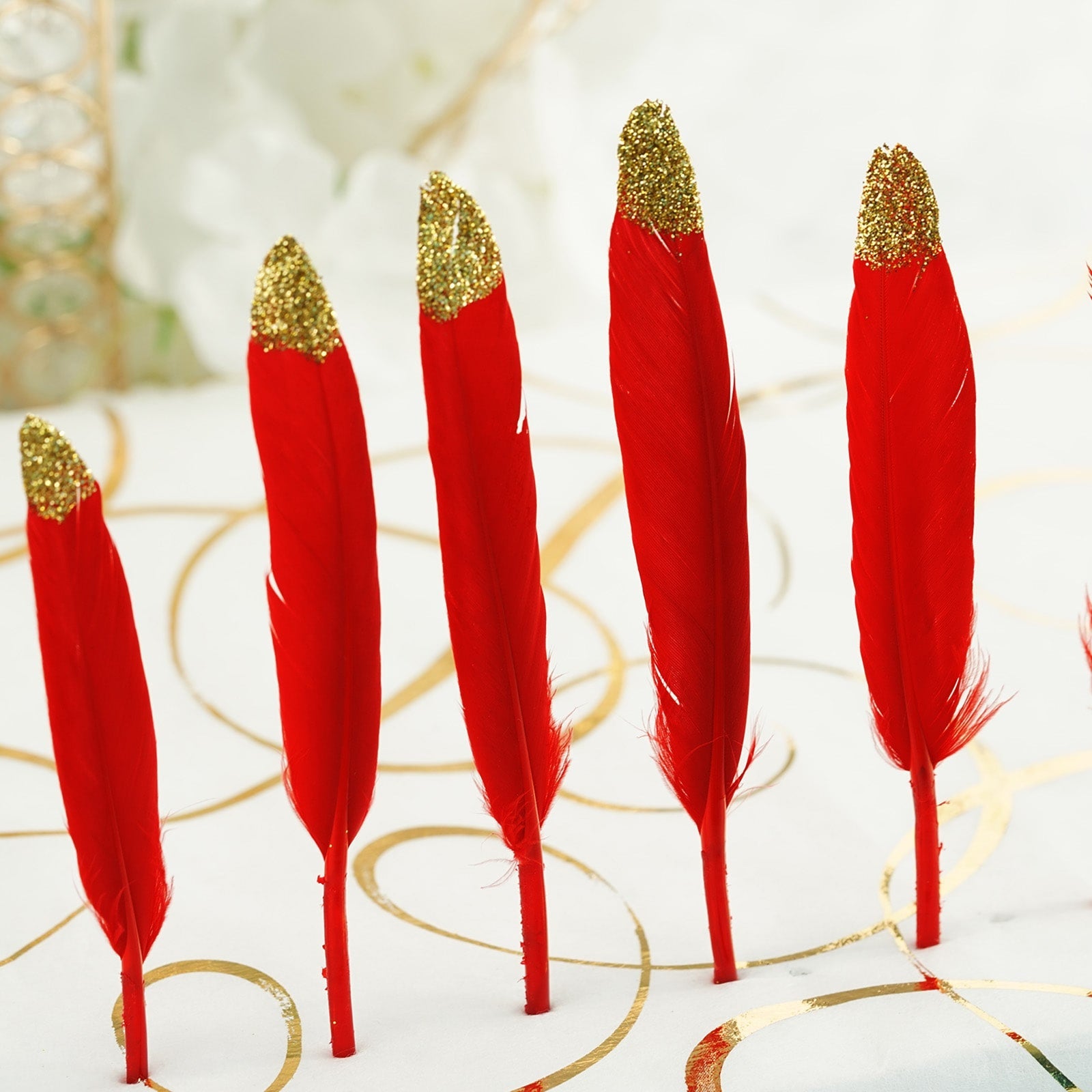 Glitter gold tip red turkey feathers for craft and party decoration.