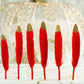 Glitter gold tip red turkey feathers for craft and party decoration.