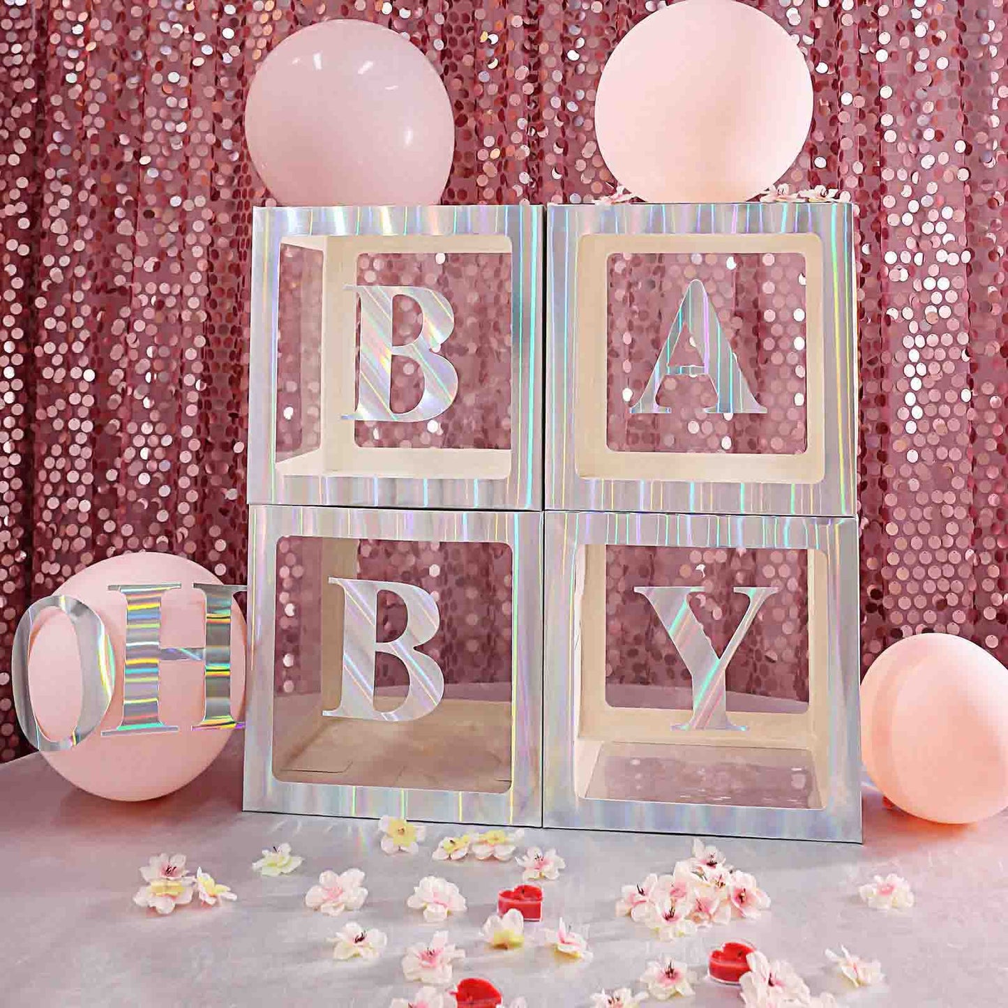 Iridescent 5" alphabet stickers spelling "BABY" on a pink backdrop.