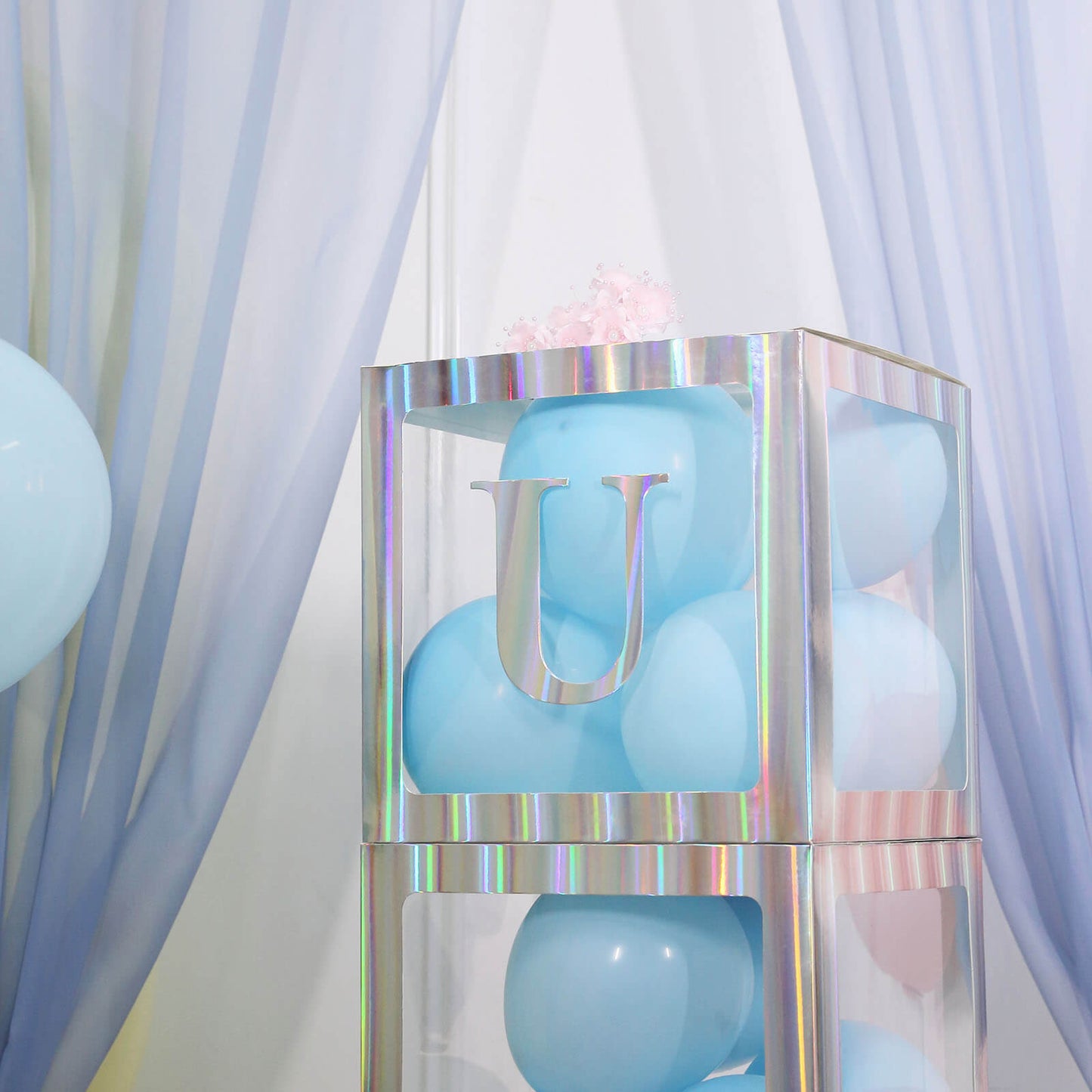 Iridescent blue alphabet sticker banner with letter U.