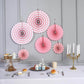 Pink hanging paper fan decorations set, ideal for party backdrops.