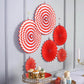 Red hanging paper fan decorations set, featuring pinwheels and backdrops for parties.