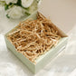 Crinkle cut natural brown paper shred basket filler in a gift box.