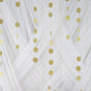 Gold circle dot party paper garland banner on a white backdrop.