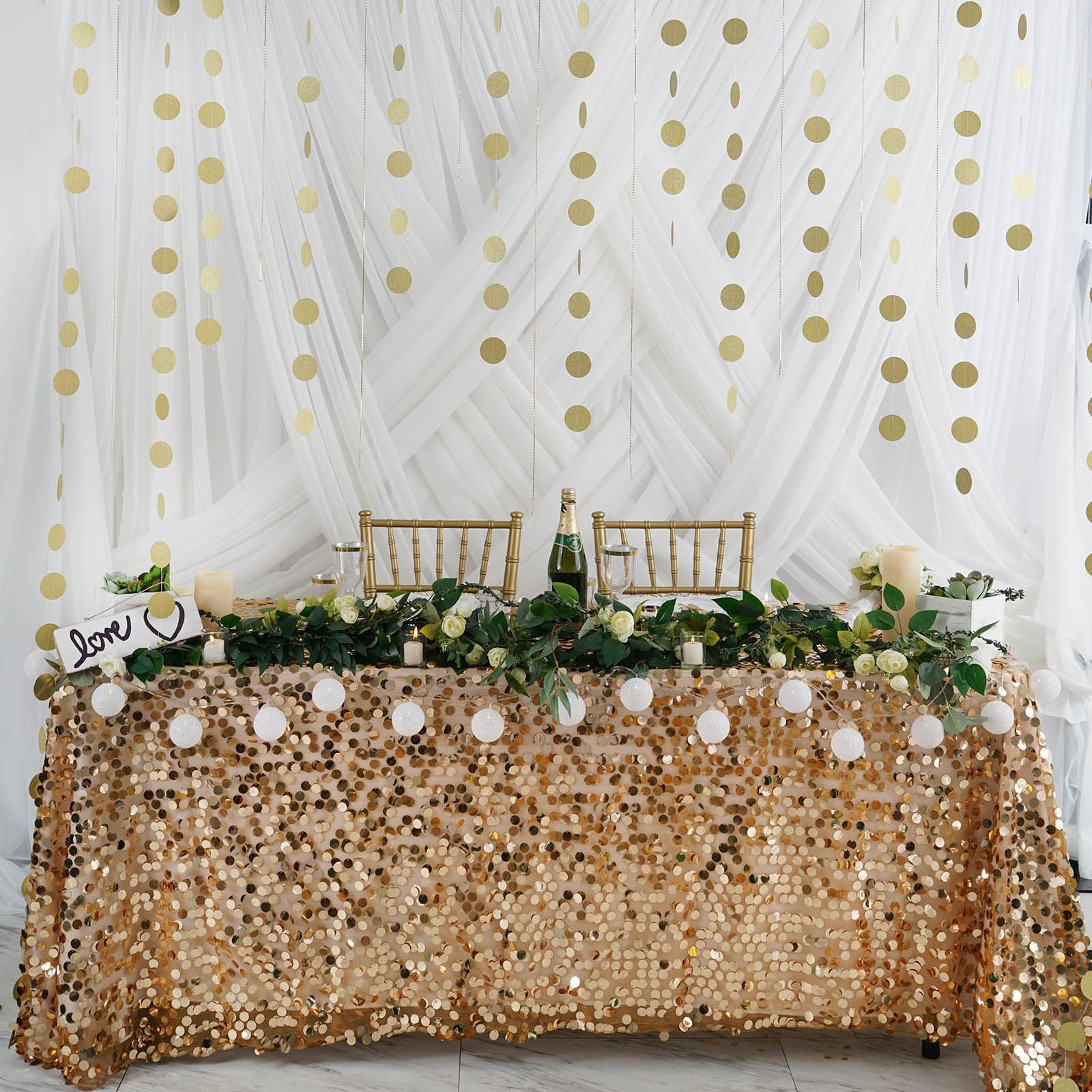 Gold circle dot party garland banner hanging backdrop for celebrations.