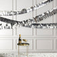 Metallic silver foil tassel fringe backdrop banner decor.