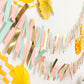 Gold, blush, and turquoise party garland streamer backdrop decoration.