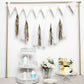 Antique gold paper fringe tassels with garland string hanging streamers.