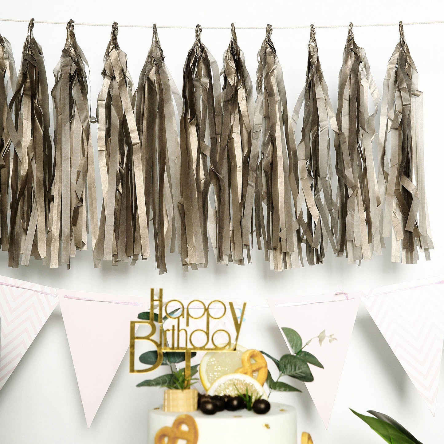 Antique gold fringe tassels banner for festive celebrations.