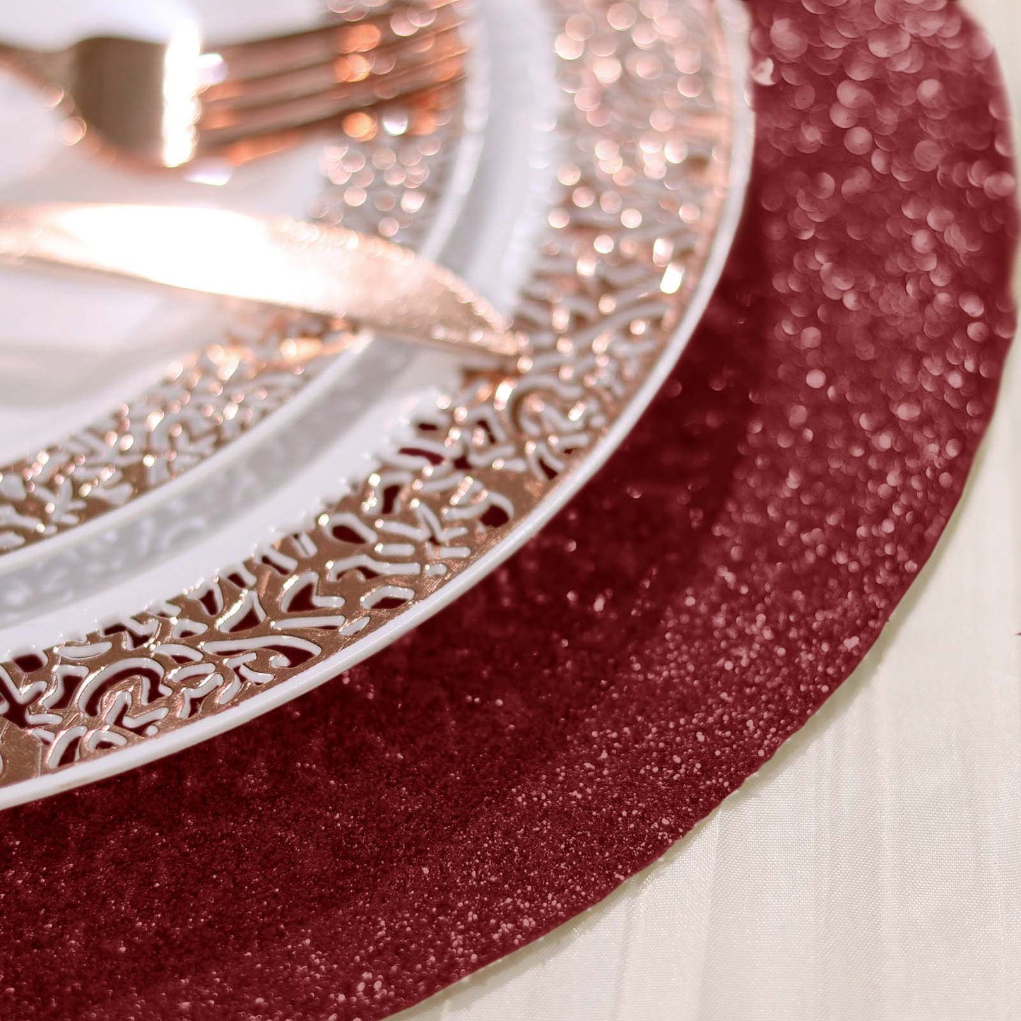 Burgundy sparkle vinyl placemat with round glitter design.