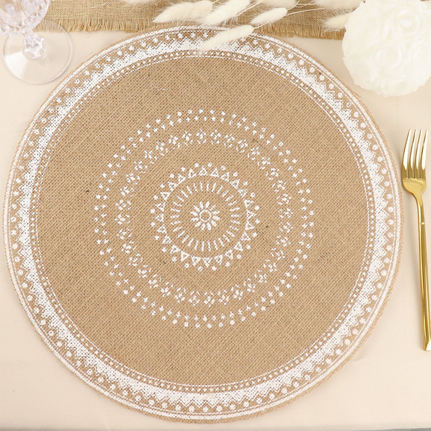 Natural jute and white round braided placemat on a table.