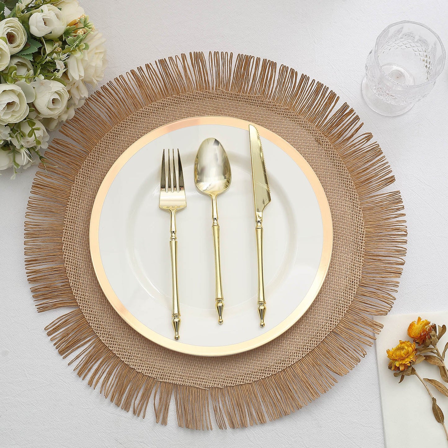 Natural rustic burlap tassel dining table mat with boho chic jute fringe.