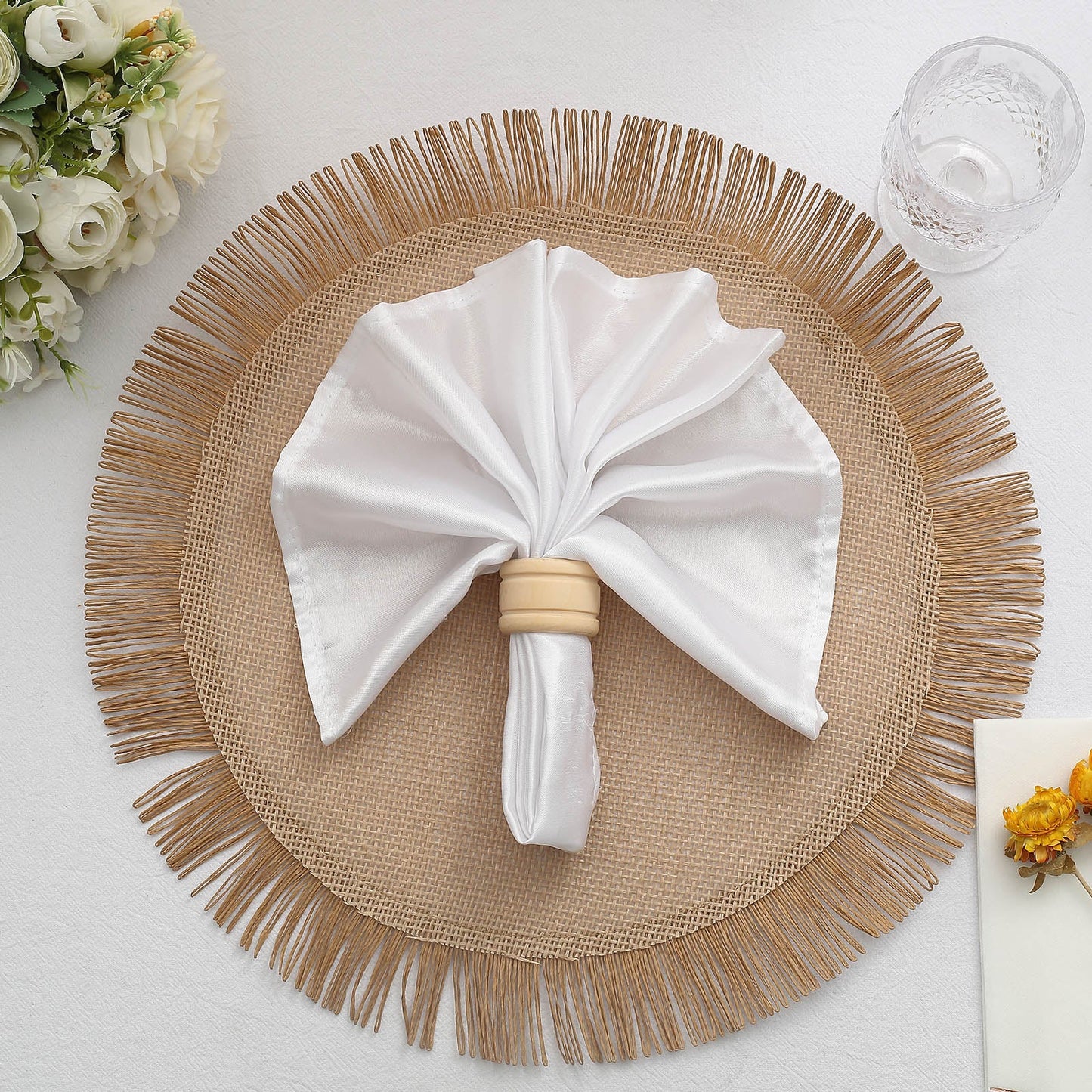 Natural rustic burlap tassel placemat with jute fringe edge.