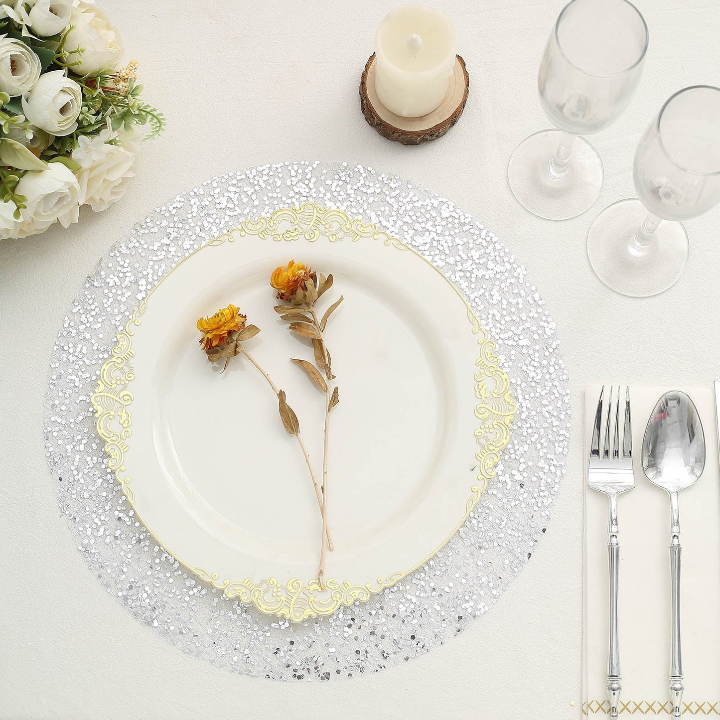 Metallic silver round sequin placemat on a dining table setting.