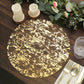 Metallic gold foil round disposable table placemat on a wooden table.