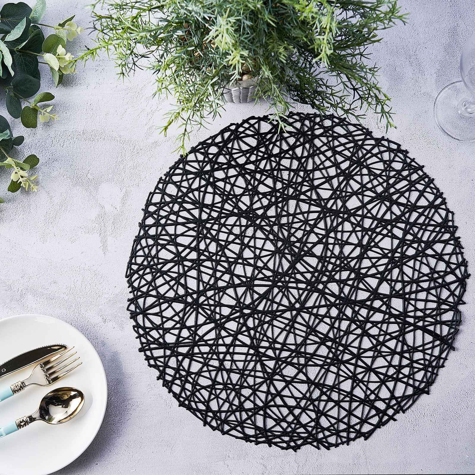 Black vinyl round placemat, decorative woven non-slip design, 15 inches.