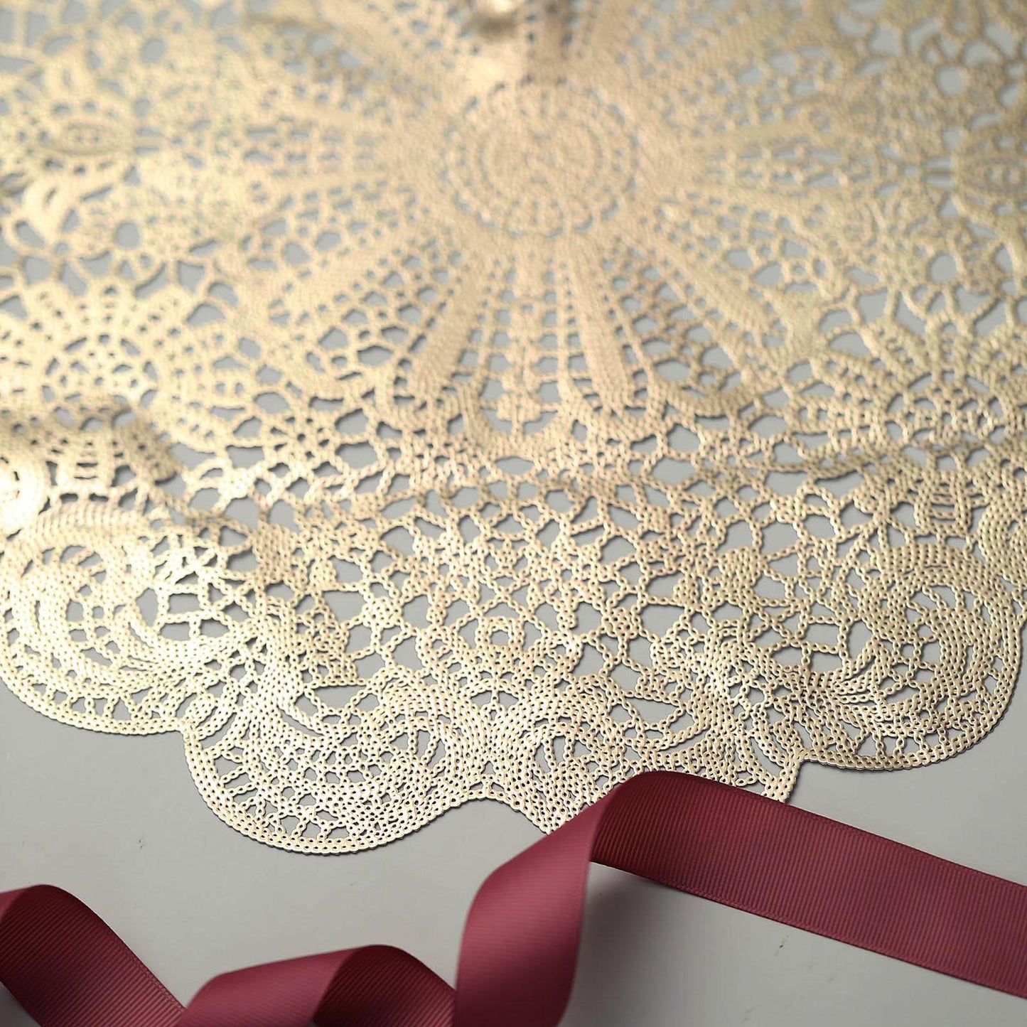 Gold vintage floral lace placemat with non-slip design.