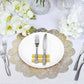 Gold vinyl placemats with vintage floral lace design on a dining table setting.
