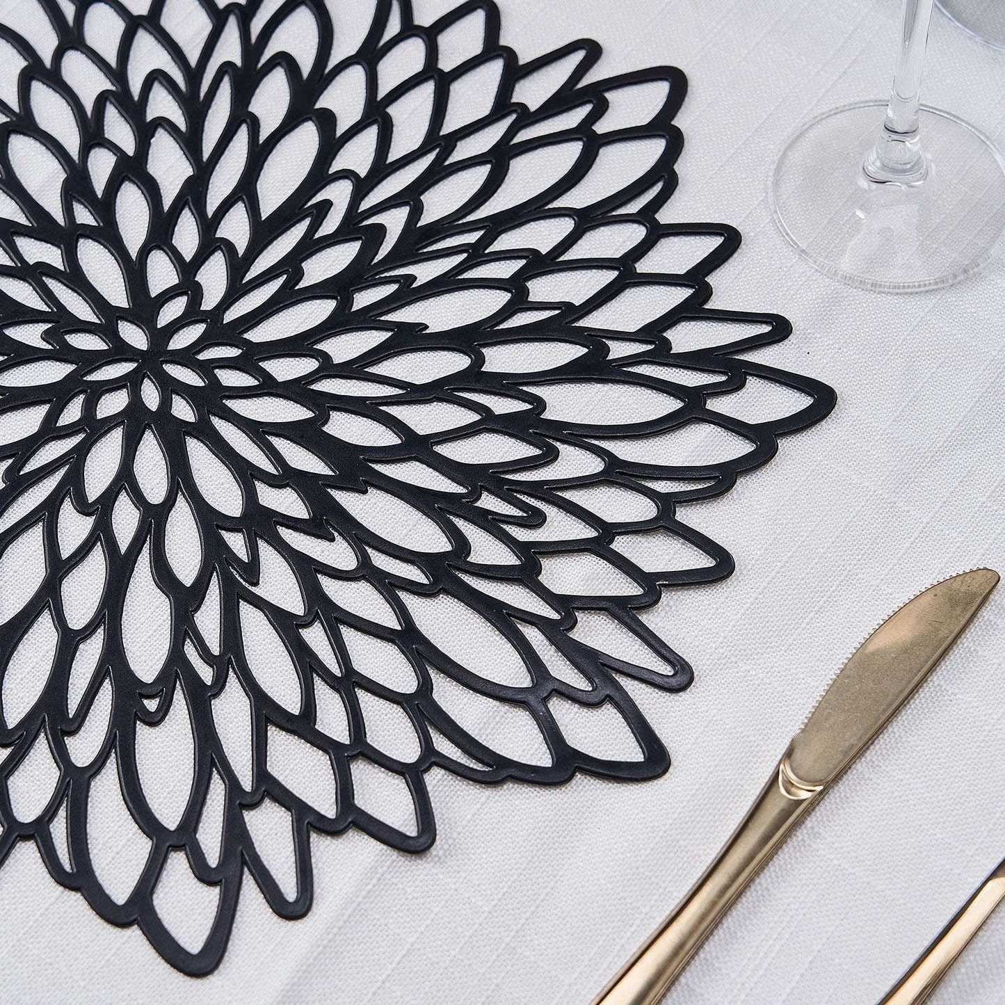 Black vinyl floral placemat for dining table, non-slip and decorative.