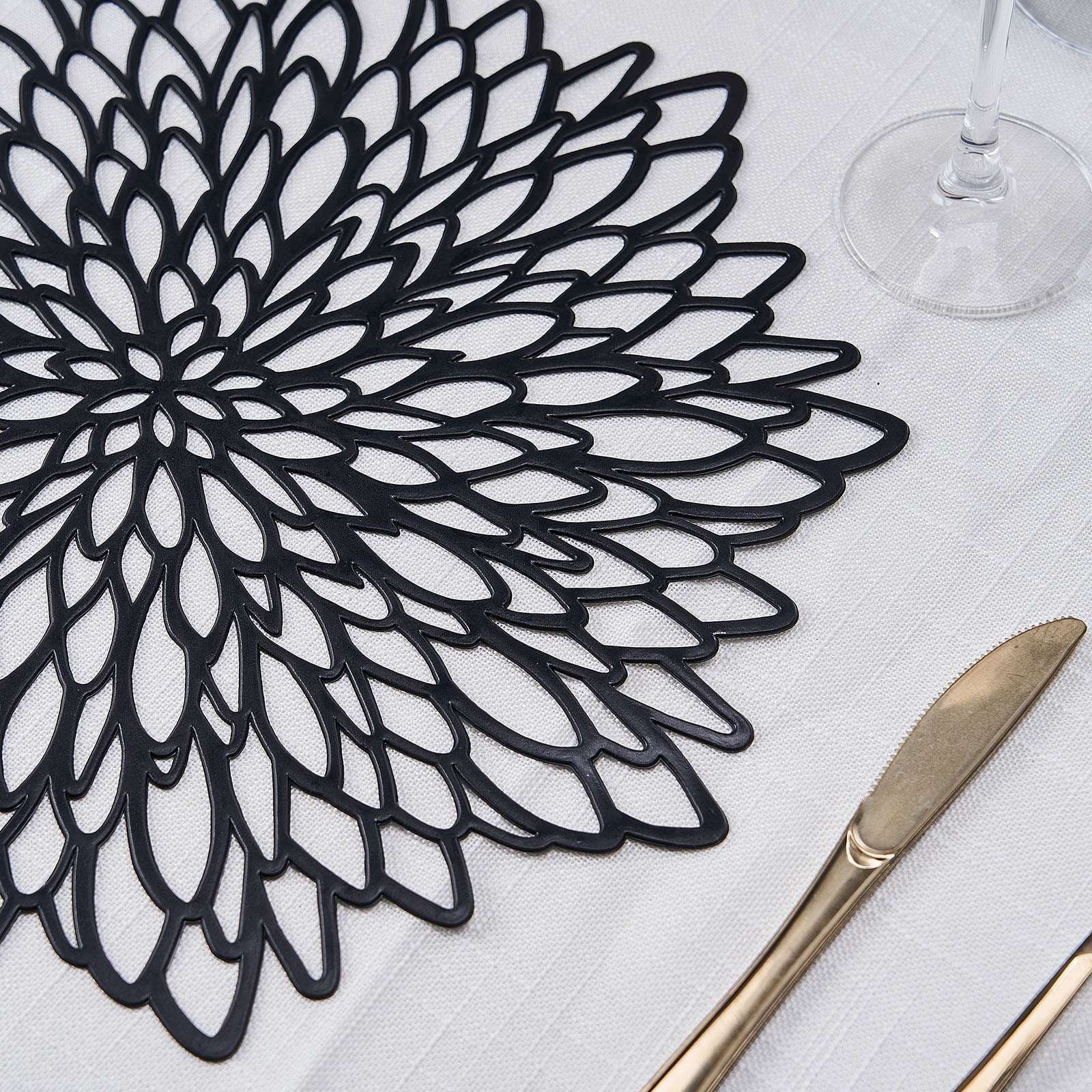 Black vinyl floral placemat for dining table, non-slip and decorative.