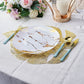 Gold monstera leaf placemat on a dining table with elegant tableware.