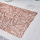 Rose gold vinyl placemat with a metallic wheat design on a table setting.