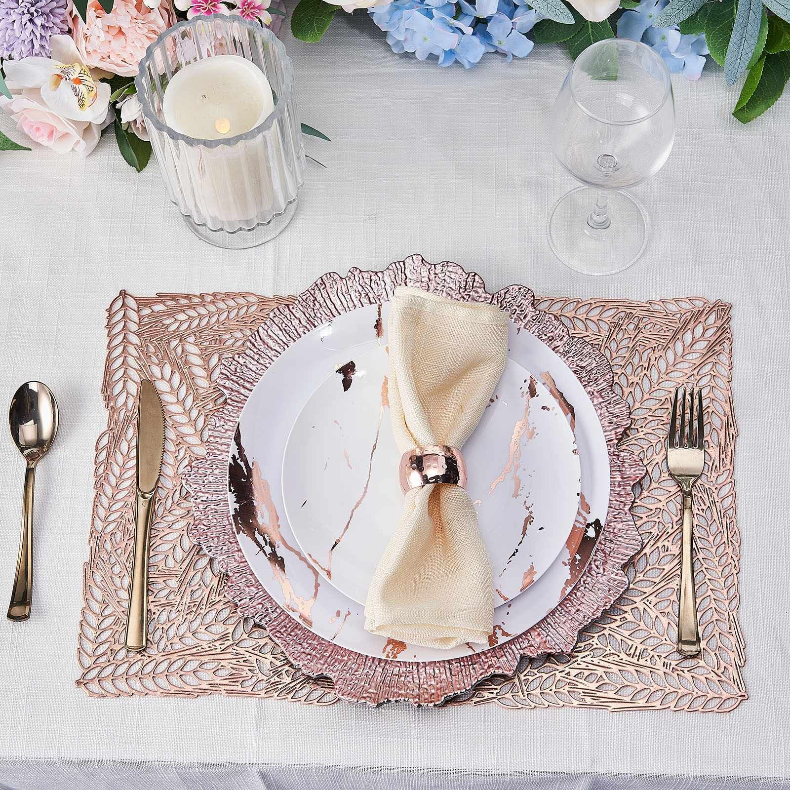Rose gold vinyl placemats with metallic wheat design on a dining table setting.