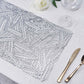 Silver vinyl placemat with a metallic wheat design on a table setting.