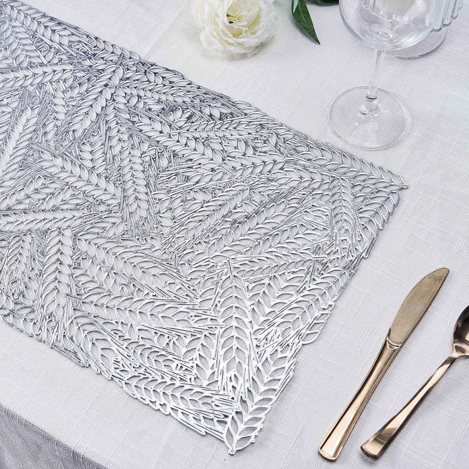 Silver vinyl placemat with a metallic wheat design on a table setting.