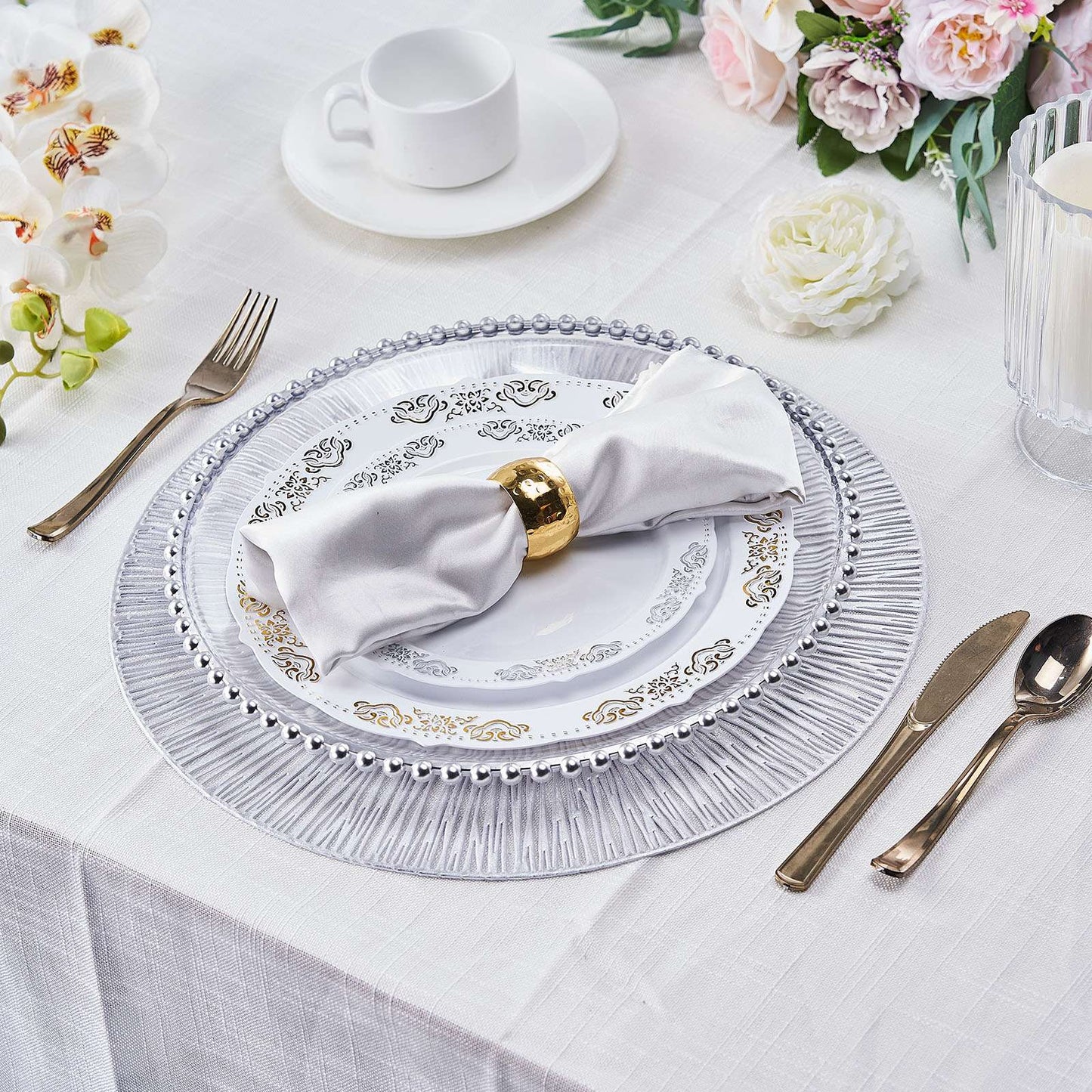 Silver metallic round placemats with a non-slip spiked design.