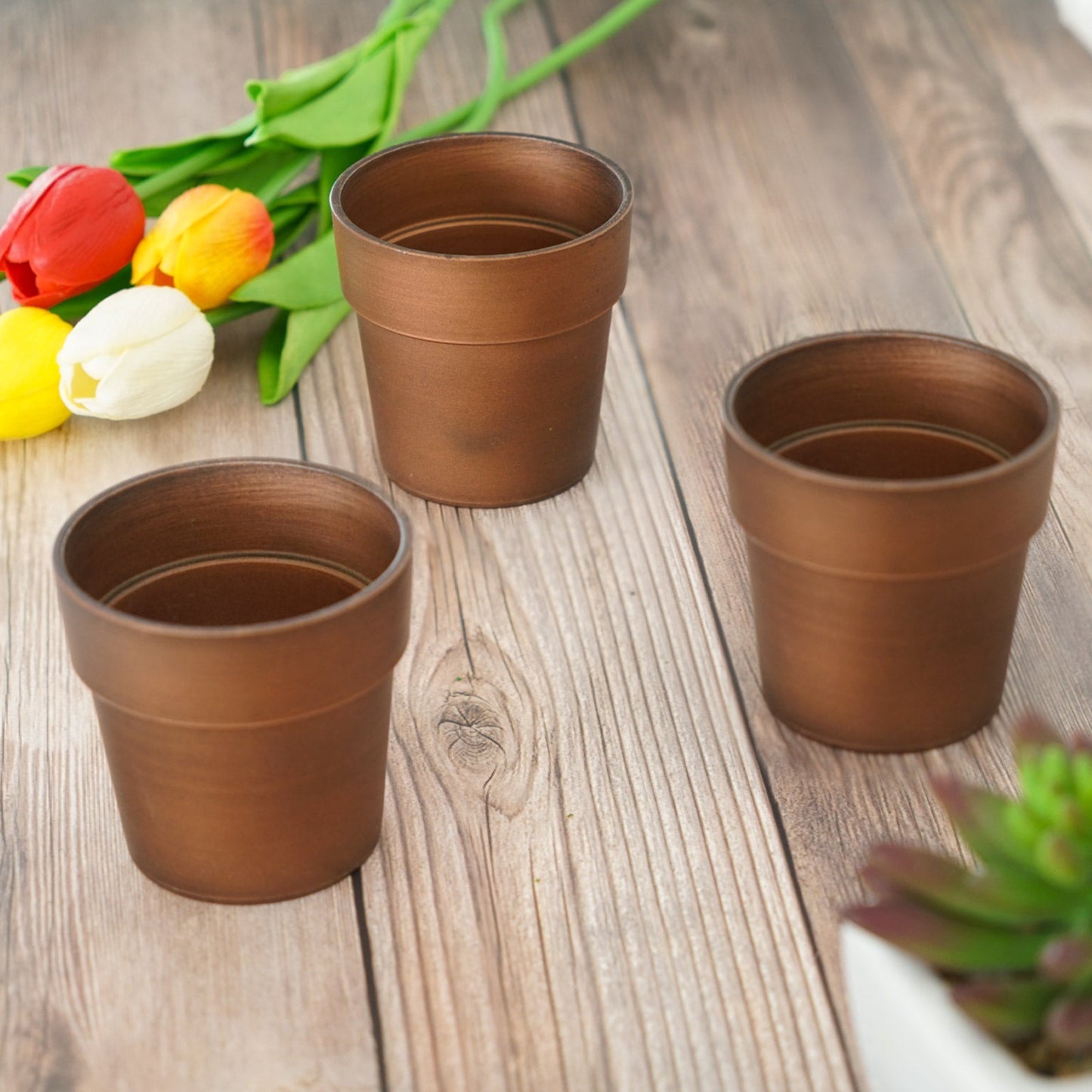 Rustic brown small flower plant pots in a set of three.