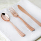 Metallic rose gold heavy duty plastic silverware set on a white napkin.