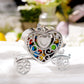 Silver heart carriage party favor gift box with colorful candies inside.